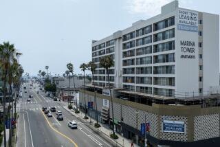 Venice, CA - July 11: An Airbnb advertised as a "Sunset studio in Marina Del Rey," is actually in this building at 415 Washington Blvd., right, on Thursday, July 11, 2024 in Venice, CA. (Brian van der Brug / Los Angeles Times)