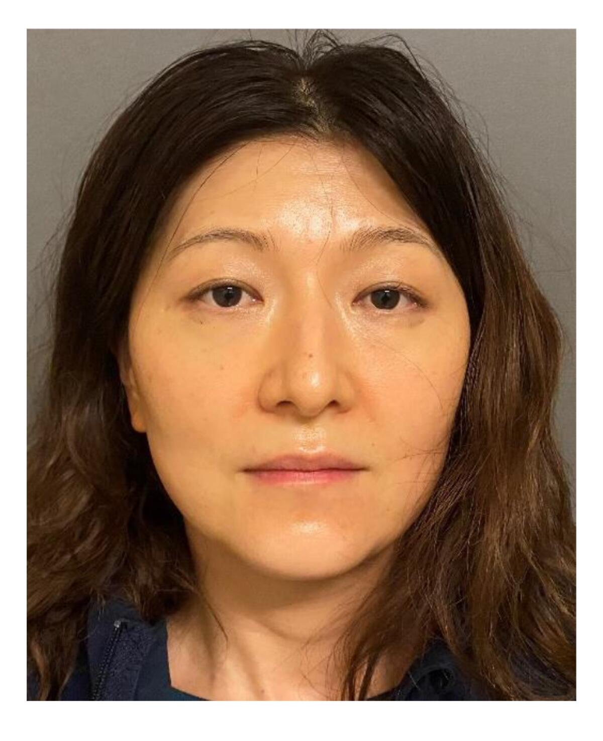 A police mug shot of Yue Yu.