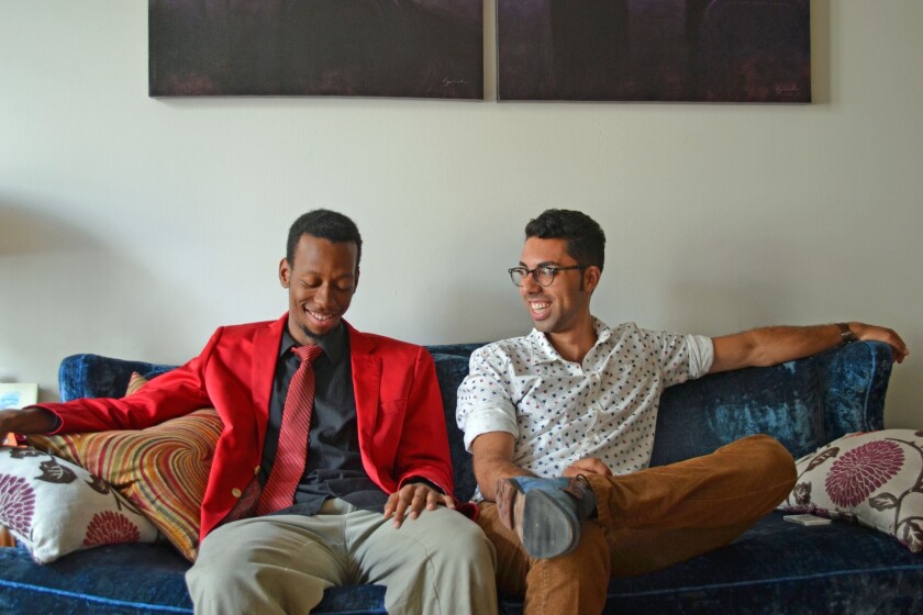 Brenton Weyi, left, and Joseph Chehouri host guests in their downtown Denver apartment as part of the Airbnb network.