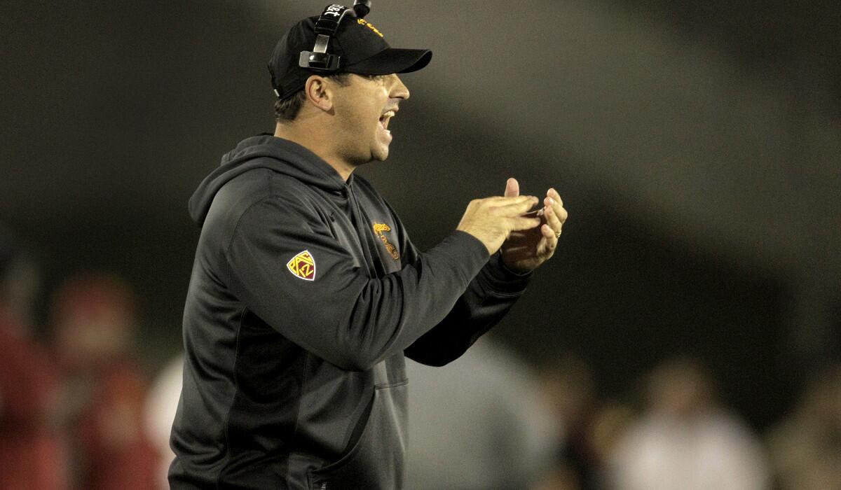 USC Coach Steve Sarkisian applauds the effort of the Trojans against California late in the fourth quarter. USC beat California, 38-30.