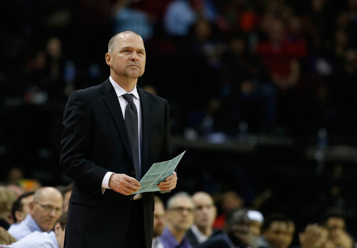 Michael Malone watches the action as the Sacramento Kings play against the Houston Rockets at the Toyota Center in Houston on Nov. 26.