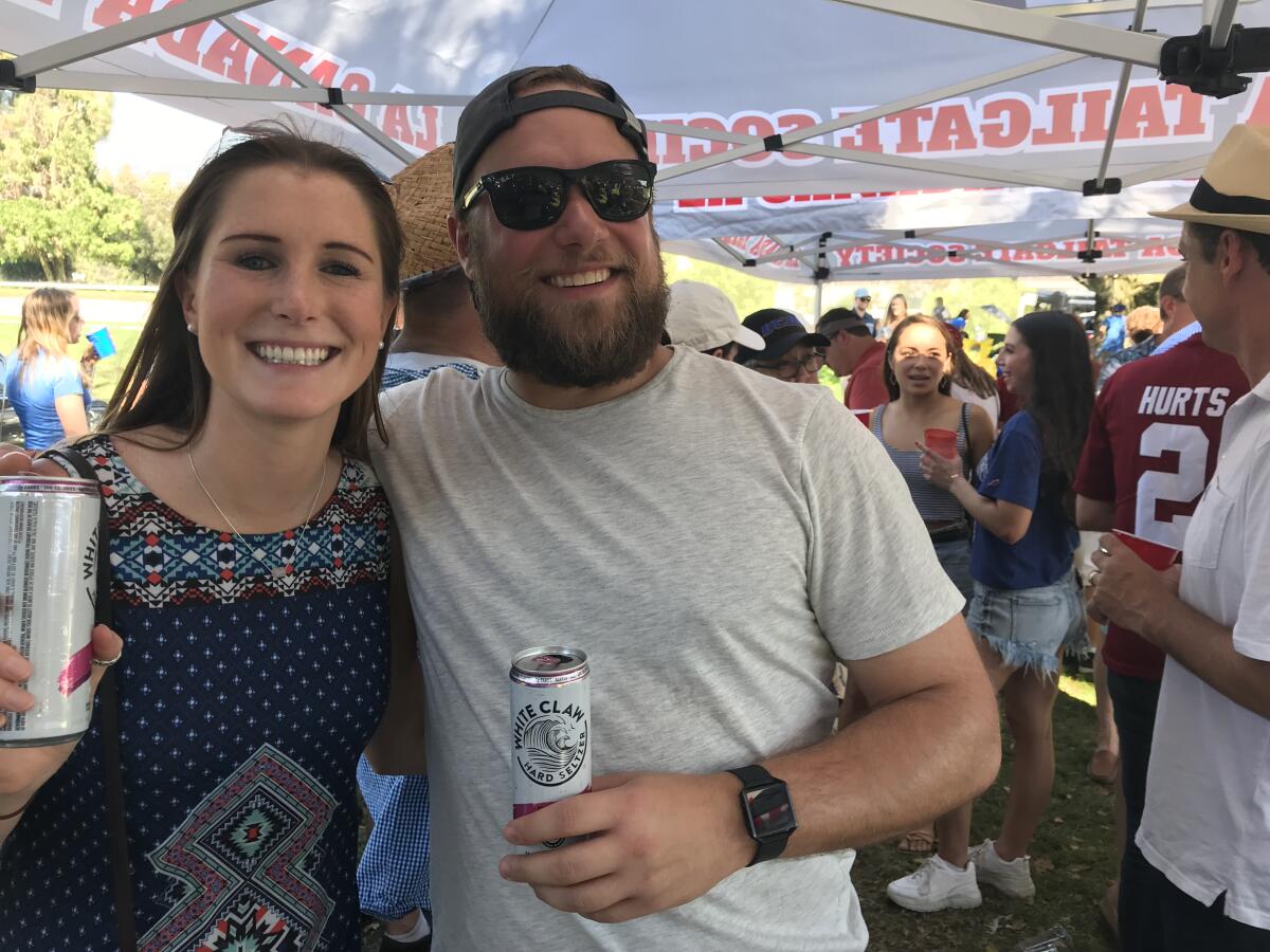 Young tailgaters armed with White Claw.