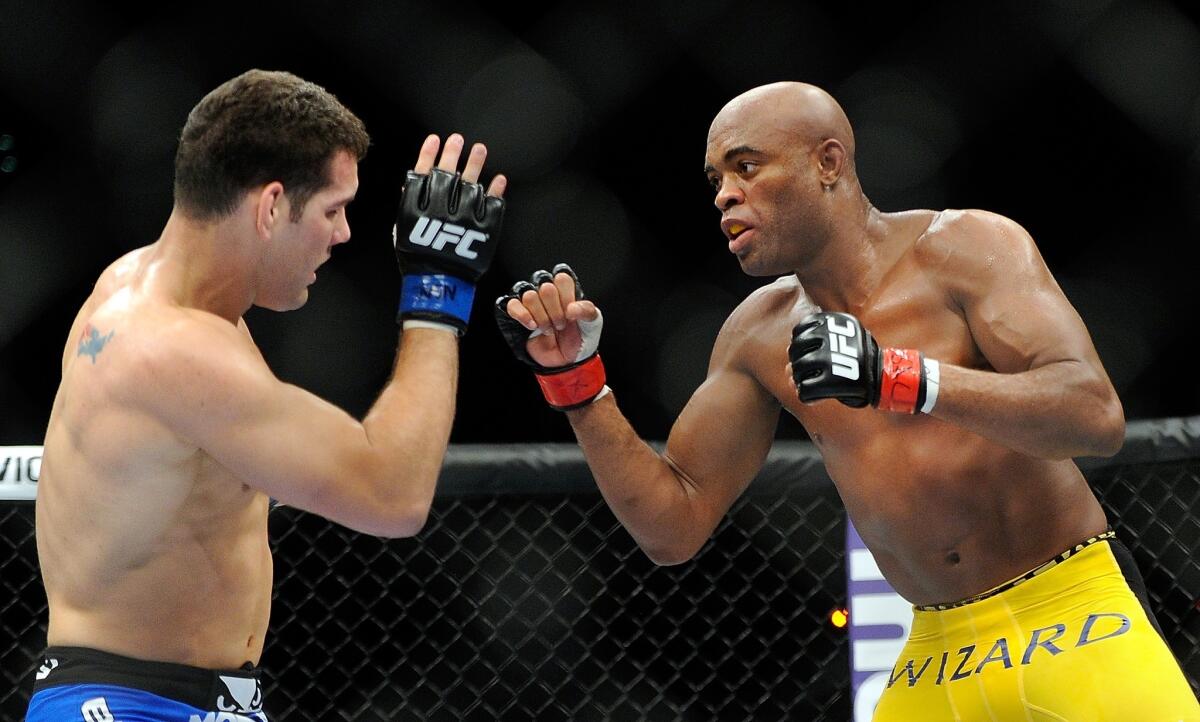 Chris Weidman, left, and Anderson Silva battle during their middleweight title fight at UFC 162 on Saturday.