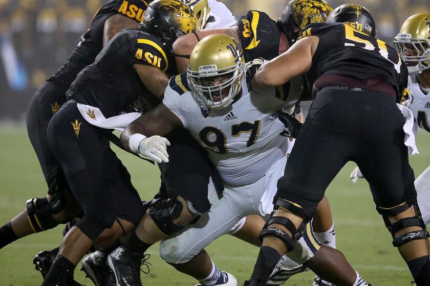 UCLA defensive lineman Kenny Clark breaks through the Arizona State offensive line during the Bruins' 62-27 win over the Sun Devils. The Bruins have recorded just four sacks this season.