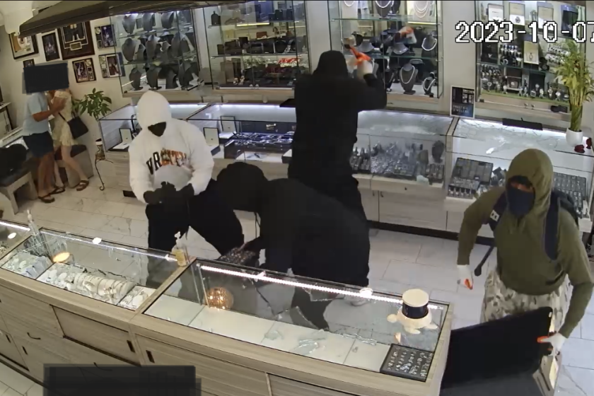 Security footage from Manhattan Beach’s Prestige Jewelers from Saturday shows five hoodie-wearing thieves smashing the store.