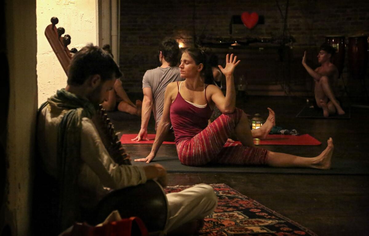 Cheri Rae Russell leads a class at her Peace Yoga Gallery in downtown L.A. "I know this is intimate, but so is life. No way around it," the 43-year-old says.