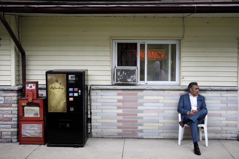 **DO NOT USE OR PUBLISH**FOR ROBERT LLOYD SUNDAY CALENDAR PIECE RUNNING FALL OF 2019. DO NOT USE PRIOR*****Hockley Valley, Ontario, Canada - 06/25/19: Actor Eugene Levy, seated, waits between takes as a scene is composed on set of 'Schitts Creek' during one of the series' final filming days, in Hockley Valley, Ontario, Canada, June 25, 2019. (PHOTOGRAPH BY COLE BURSTON / FOR THE TIMES)