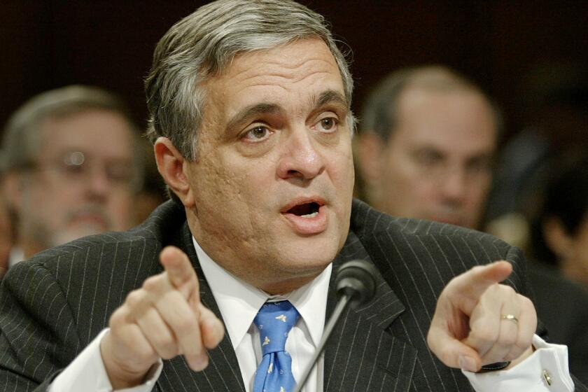 CIA Director George Tenet testifies on Capitol Hill in March 2004.