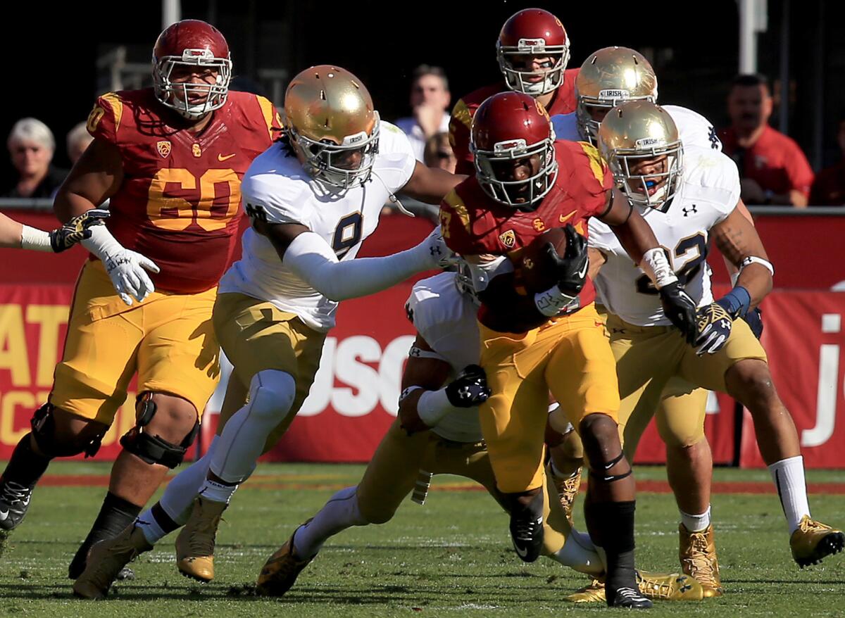 USC tailback Javorius Allen breaks into the Notre Dame defensive backfield during the first quarter of a game on Nov. 29.