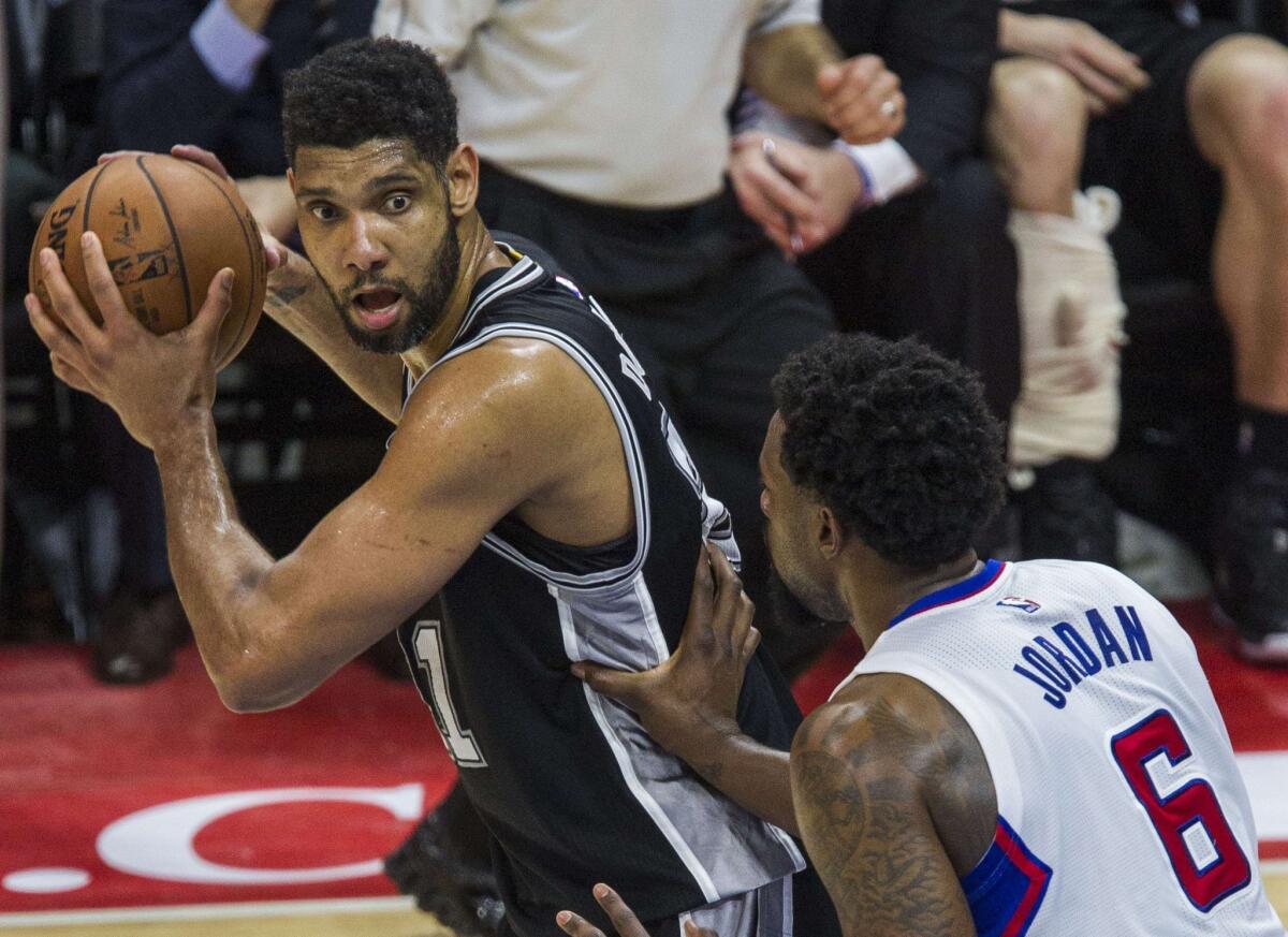 San Antonio's Tim Duncan faces the Clippers' DeAndre Jordan during the NBA playoffs in May.