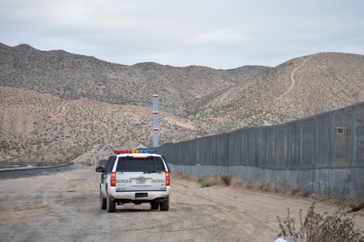 In this Jan. 4, 2016 photo, a U.S. Border Patrol agent patrols Sunland Park along the U.S.-Mexico border next to Ciudad Juarez.
