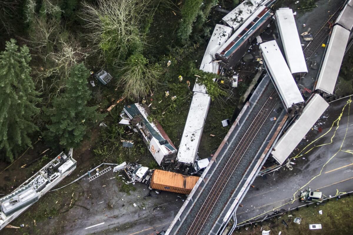 Cars from an Amtrak train that derailed hit vehicles on Interstate 5 in Washington.