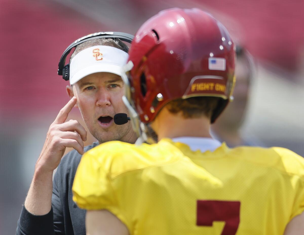 USC coach Lincoln Riley talks with quarterback Miller Moss 