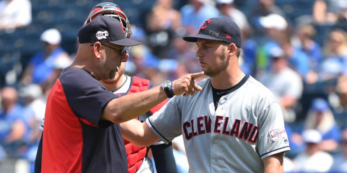 Cleveland Indians manager Terry Francona gestures as starting pitcher Trevor Bauer leaves the game in the fifth inning Sunday against the Kansas City Royals.