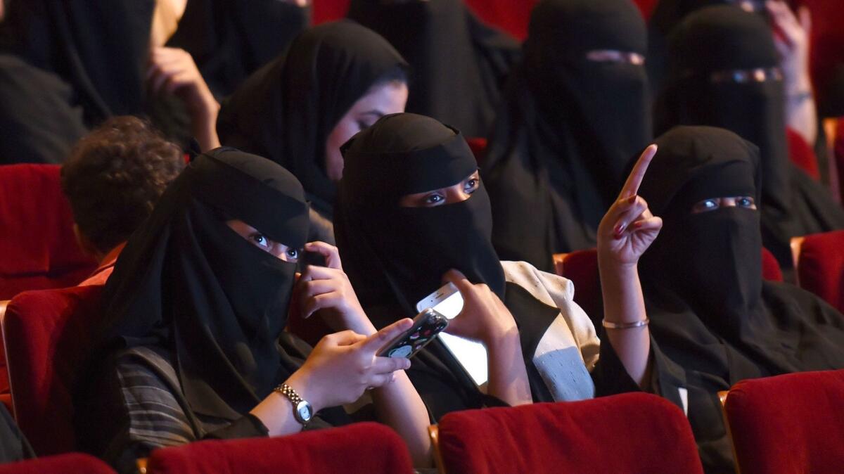 Saudi women attend the "Short Film Competition 2" festival at King Fahad Culture Center in Riyadh.