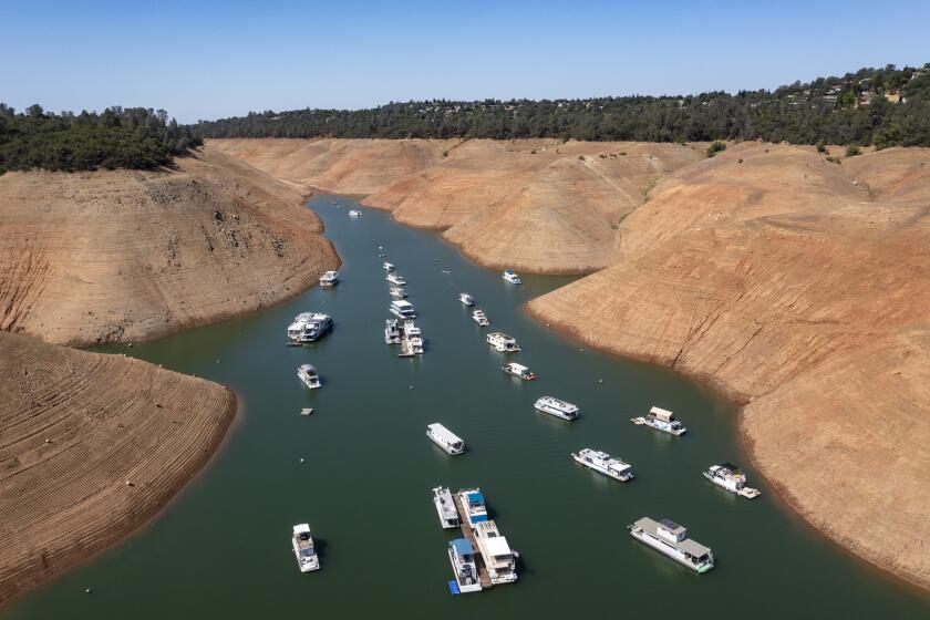 OROVILLE, CA - JUNE 29: Boats are moored in a shrinking arm of Lake Oroville, which stands at 33 percent full and 40 percent of historical average when this photograph was taken on Tuesday, June 29, 2021 in Oroville, CA. (Brian van der Brug / Los Angeles Times)