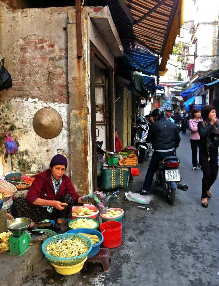 A vendor sells tofu along a narrow street leading to Dong Xuan Market in Hanoi, which is emerging as a foodie mecca. Soup is a way of life here, but finding the perfect bowl is a quest that will lead you throughout the city. Along the way, you'll find religion, history, art and the theater of everyday life.