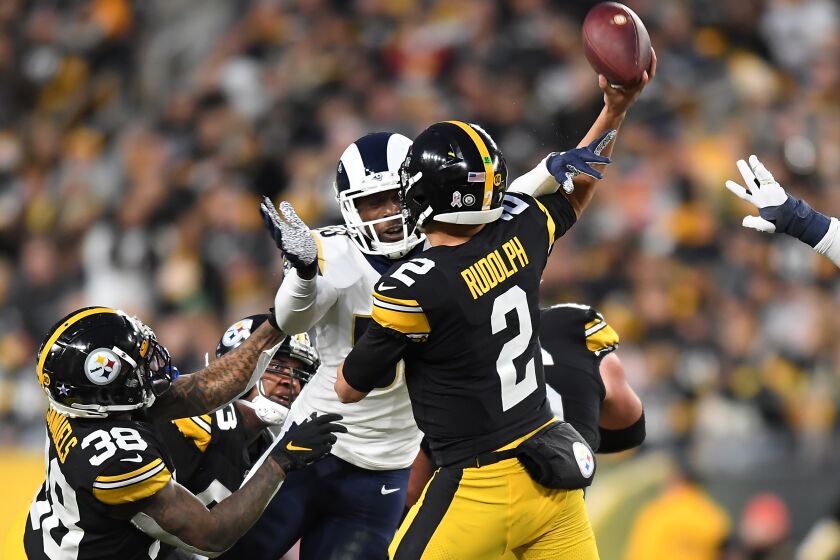 PITTSBURGH, PENNSYLVANIA NOVEMBER 10, 2019-Rams linebacker Cory Littleton hits the arm of Steelers quarterback Mason Rudolph to force an incomplete pass in the 2nd quarter at Heinz Field in Pittsburgh Sunday. (Wally Skalij/Los Angerles Times)