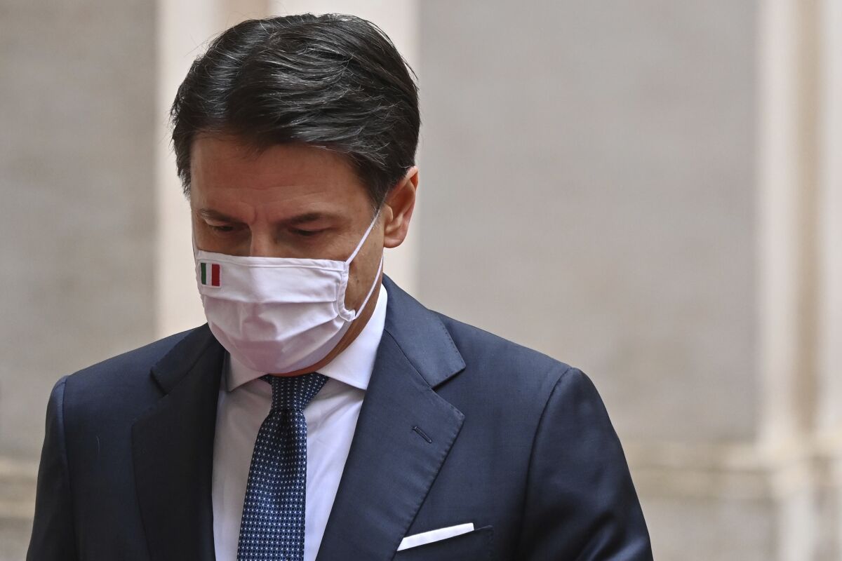 FILE - Italy's outgoing Premier, Giuseppe Conte leaves Chigi Palace Premier's office in Rome, Feb. 13, 2021. The head of the 5-Star Movement said Wednesday, July 13, 2022 the party’s lawmakers won’t participate in a confidence vote in the upper chamber of Parliament, putting Premier Mario Draghi’s coalition government at risk. Former Premier Giuseppe Conte announced the move in a late-night briefing with 5-Star lawmakers.(Alberto Pizzoli/Pool via AP, file)