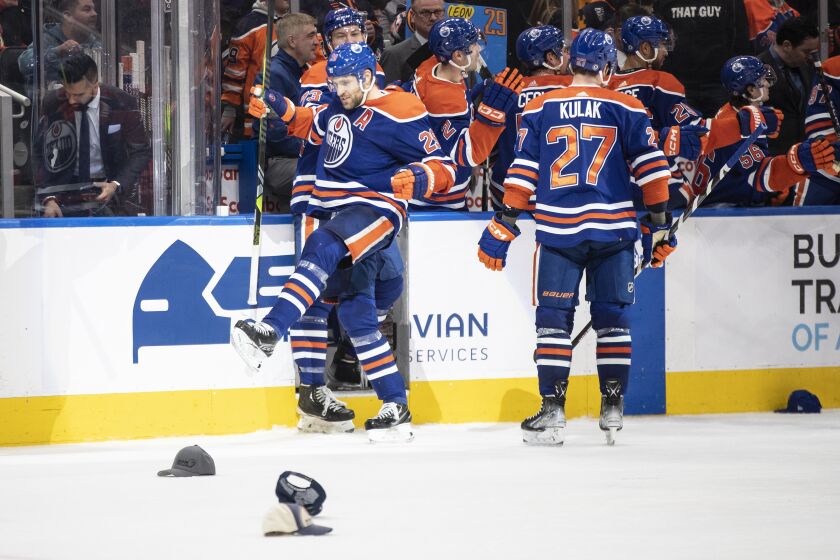 Edmonton Oilers' Leon Draisaitl (29) celebrates a hat trick against the Anaheim Ducks during the third period of an NHL hockey game Saturday, April 1, 2023, in Edmonton, Alberta. (Jason Franson/The Canadian Press via AP)