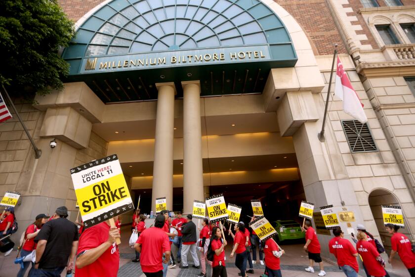 LOS ANGELES, CA - JULY 2, 2023 - Hotel workers picket in front of the Biltmore Hotel as members of Unite Here Local 11 joined dozens of other southland hotels who went on strike today in downtown Los Angeles on July 2, 2023. Hotel workers formed picket lines at many of the hotels in an effort to secure higher pay and improvements in health care and retirement benefits. The contract between the hotels and Unite Here Local 11 expired at 12:01 a.m. on Saturday (Genaro Molina / Los Angeles Times)