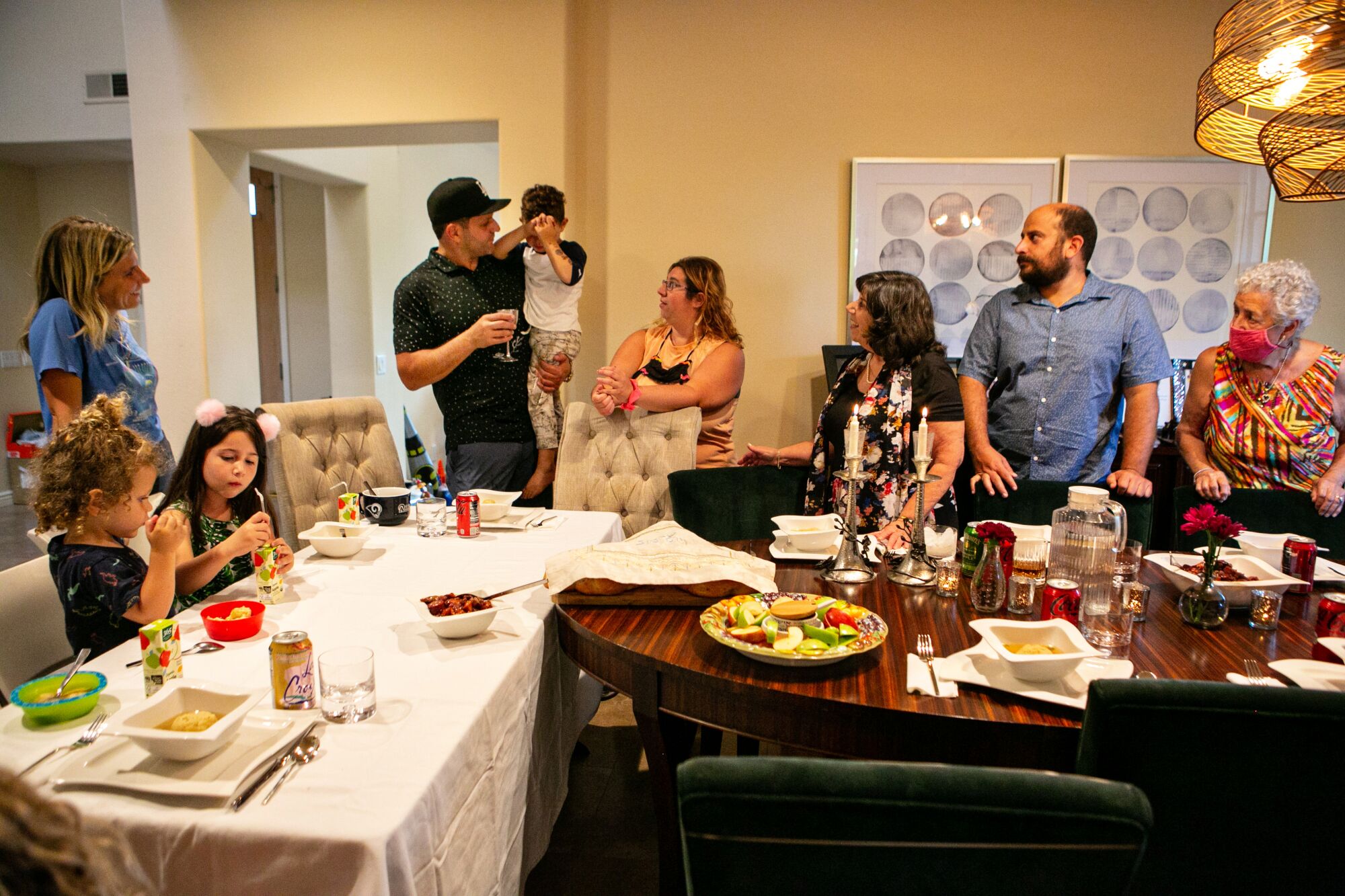 Pamela Taylor's extended family gather for Rosh Hashanah dinner in Calabasas on Sept. 6, 2021, in Calabasas, CA.