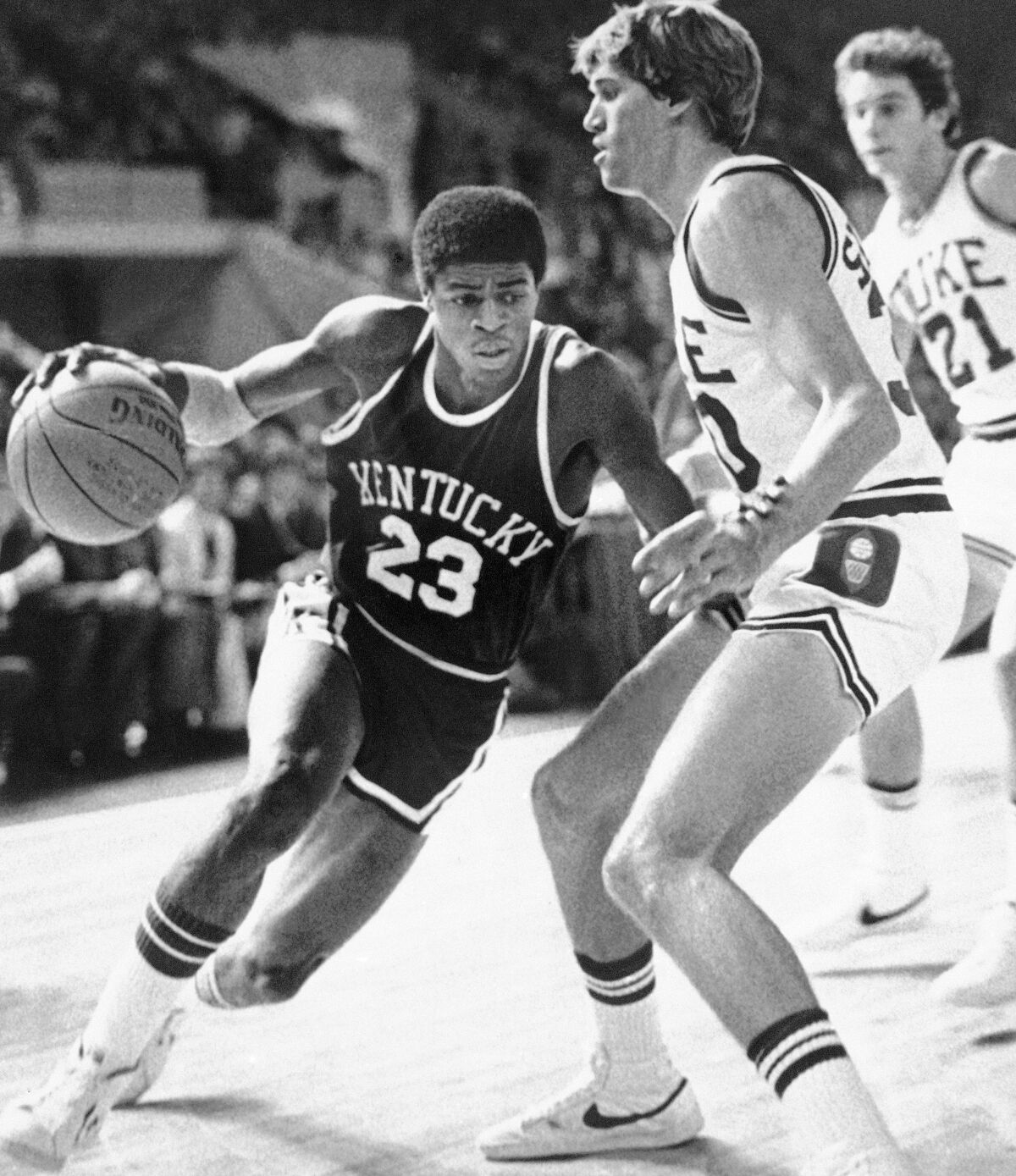 FILE - University of Kentucky's Dwight Anderson drives past Duke University's Jim Suddath during the first half of an NCAA college basketball game in Springfield, Mass., Nov. 17, 1979. Dwight Anderson, who earned the nickname “The Blur" because of his speed on the court playing basketball at Kentucky and Southern California, has died. He was 59. Anderson died last Saturday, Sept. 5, 2020, in his hometown of Dayton, Ohio, according to USC. The cause was not immediately known.(AP Photo/Paul Benoit, File)