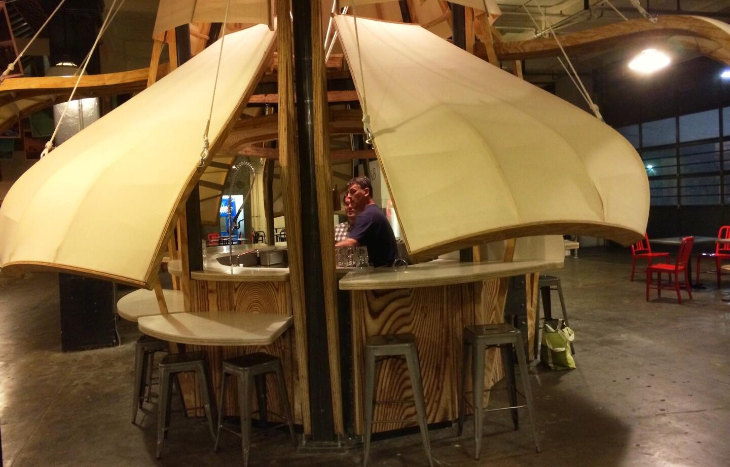 An ingenious canvas and plywood structure raises and lowers.