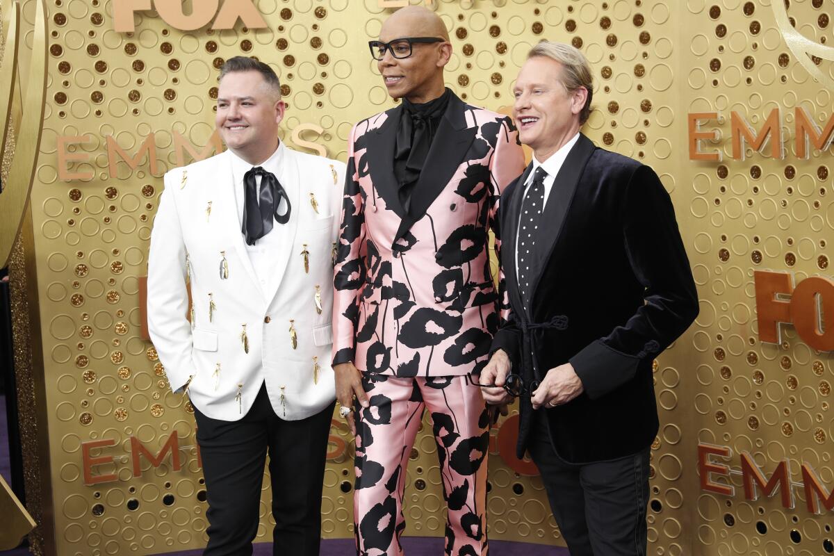 RuPaul, flanked by Ross Mathews, left, and Carson Kressley arriving Sunday at the Emmy Awards at the Microsoft Theater in Los Angeles.