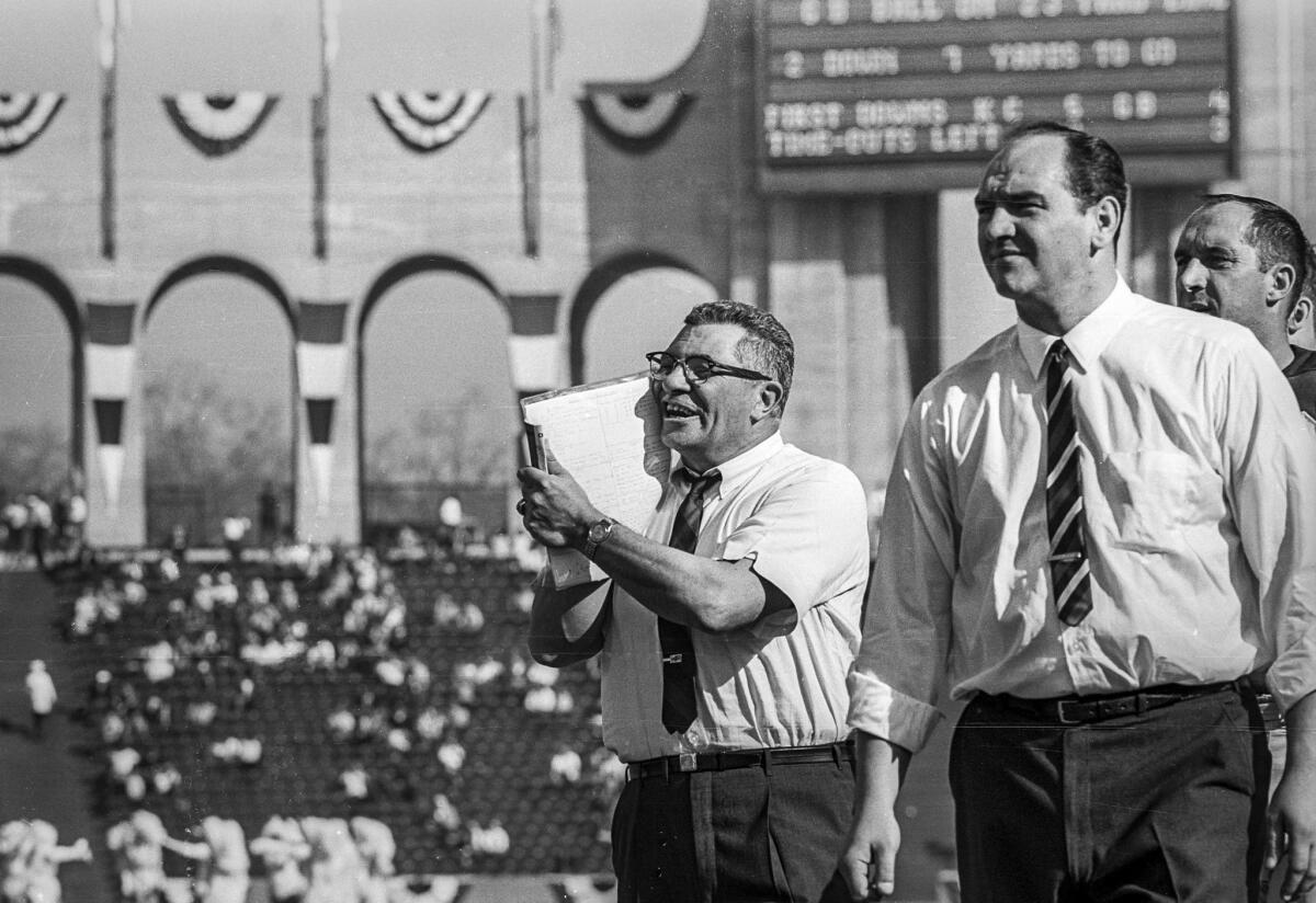 Jan. 15, 1967: Green Bay Packers head coach Vince Lombardi, center, on sidelines at Los Angeles Memorial Coliseum during first Super Bowl game against the Kansas City Chiefs.