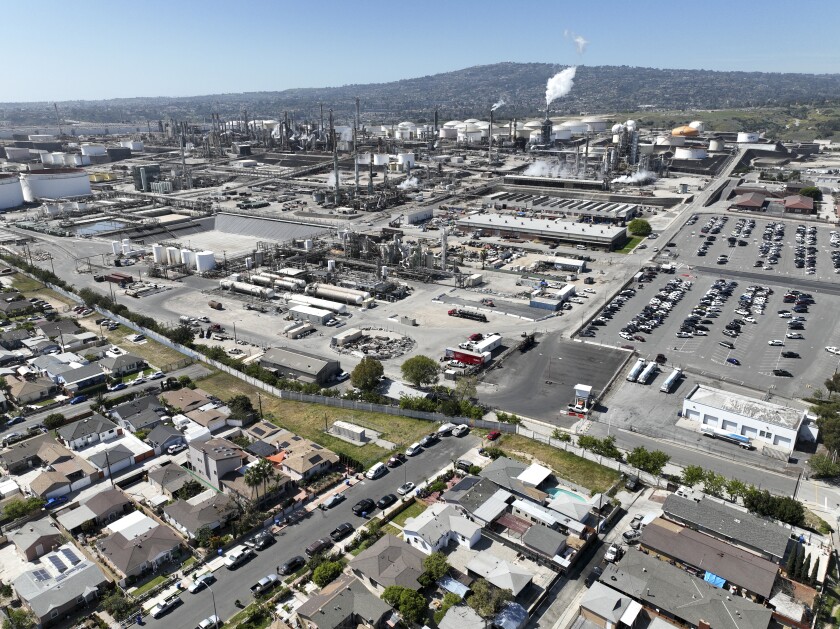 An overhead view of a Wilmington neighborhood next to refineries.