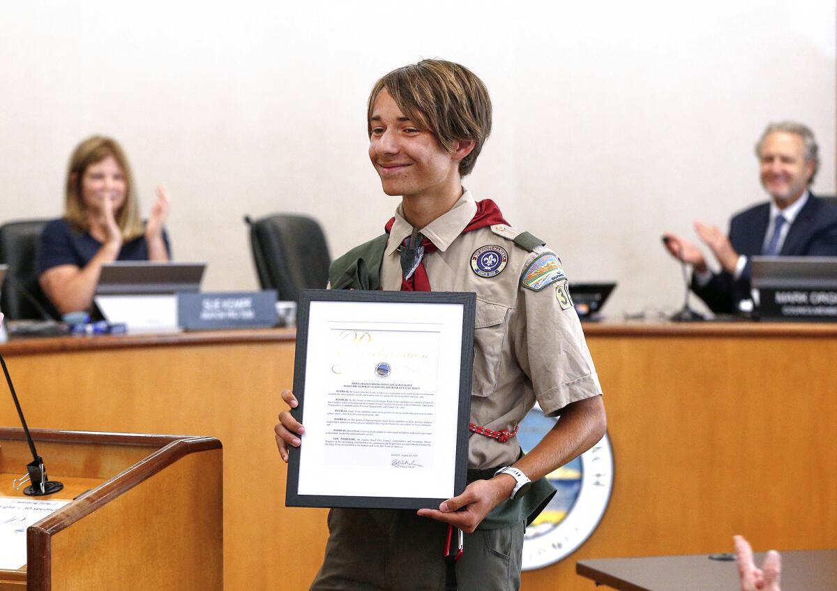 Eagle Scout Mason Bruderer receives a round of applause at the Laguna Beach City Council meeting on Tuesday.