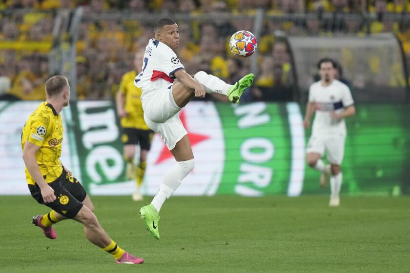 PSG's Kylian Mbappe is in action during the Champions League semifinal first leg soccer match between Borussia Dortmund and Paris Saint-Germain at the Signal-Iduna Park stadium in Dortmund, Germany, Wednesday, May 1, 2024. (AP Photo/Matthias Schrader)