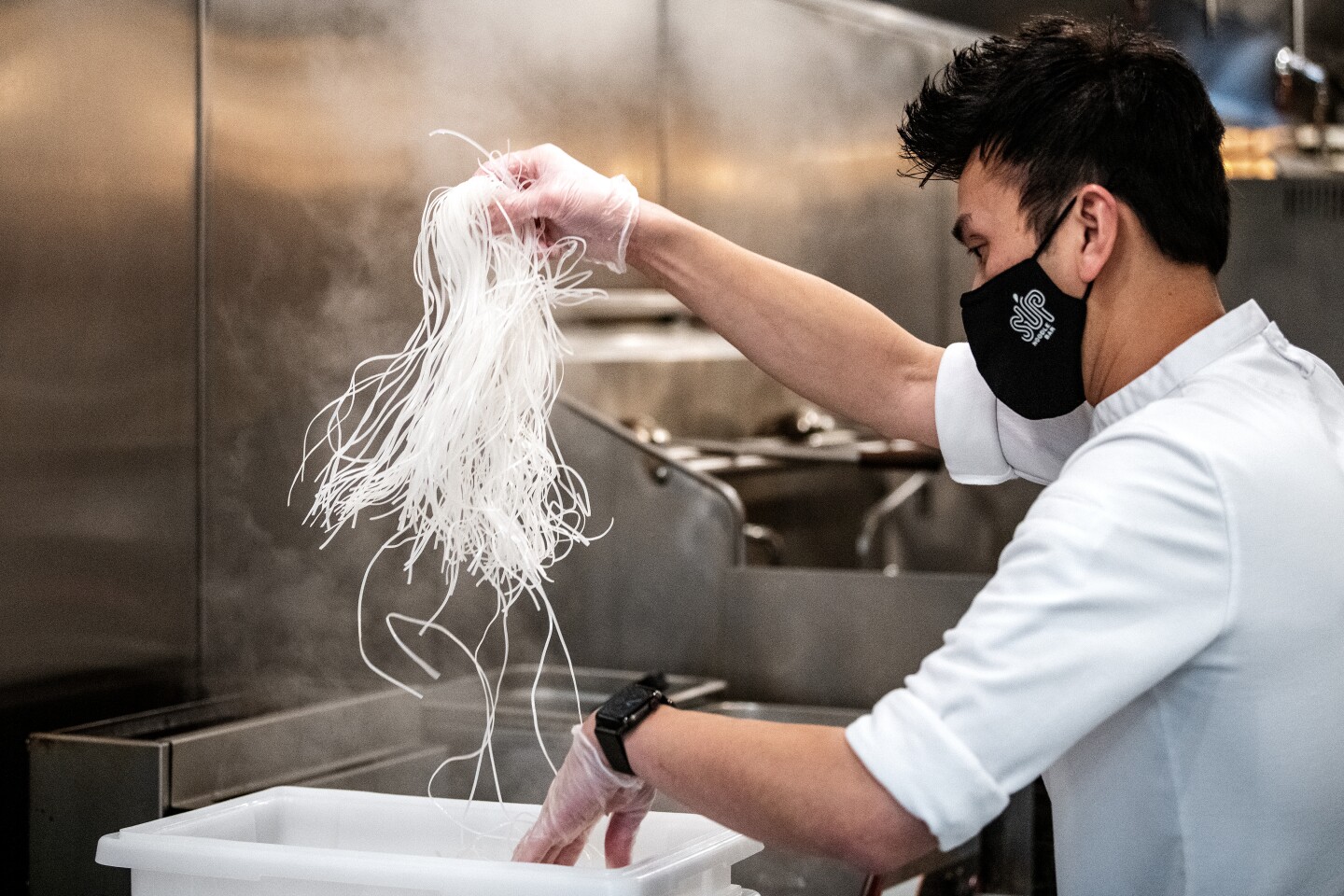 IRVINE, CA - FEBRUARY 09: Chef Viet Nguyen, owner of Sup Noodle Bar, demonstrates the process of making his Rib bone pho at Sup Noodle Bar on Tuesday, Feb. 9, 2021 in Irvine, CA. (Mariah Tauger / Los Angeles Times)