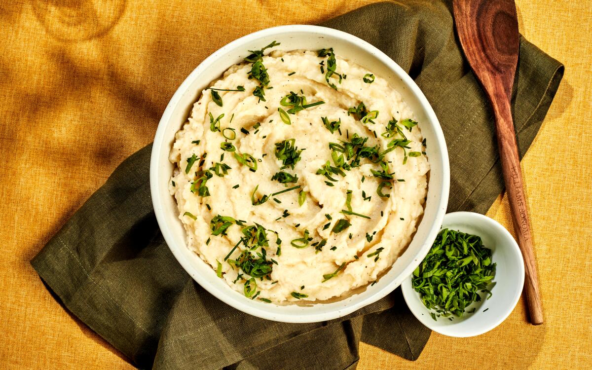 Tangy buttermilk lightens mashed potatoes made with russet potatoes for Thanksgiving.