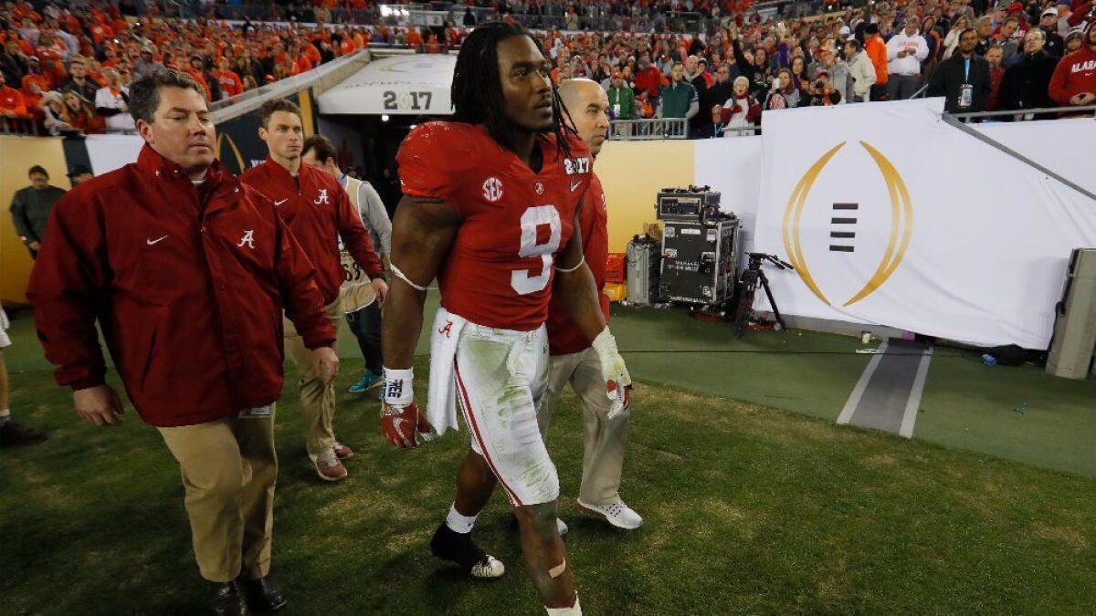 Alabama running back Bo Scarbrough returns to the field after suffering an apparent leg injury during the national championship game on Jan. 9.