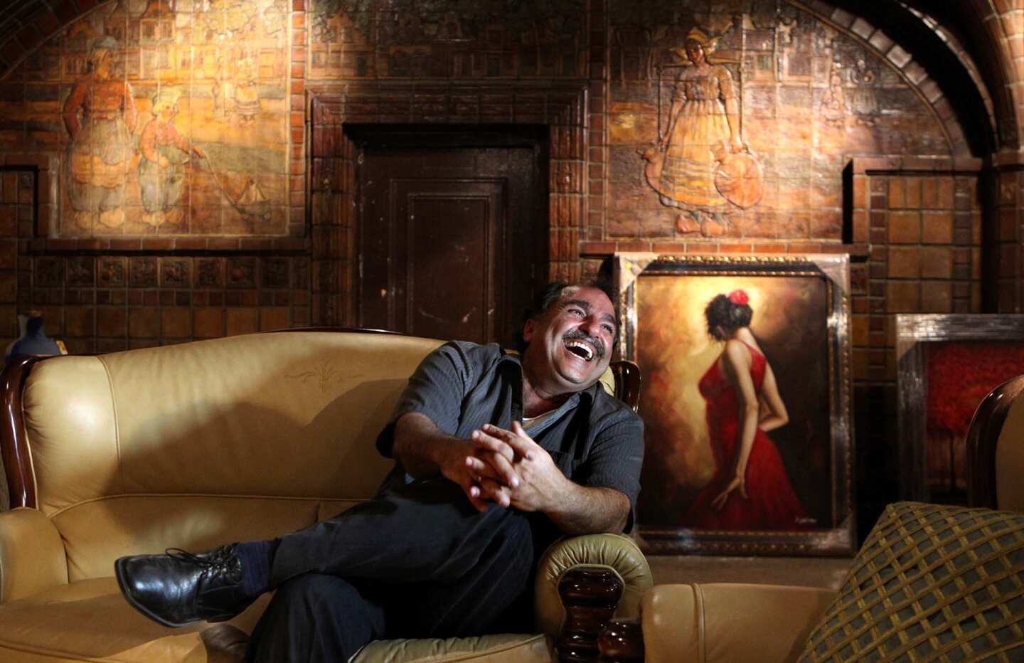 Charles Aslan sits in his leased space, filled with Batchelder tile, in downtown Los Angeles.