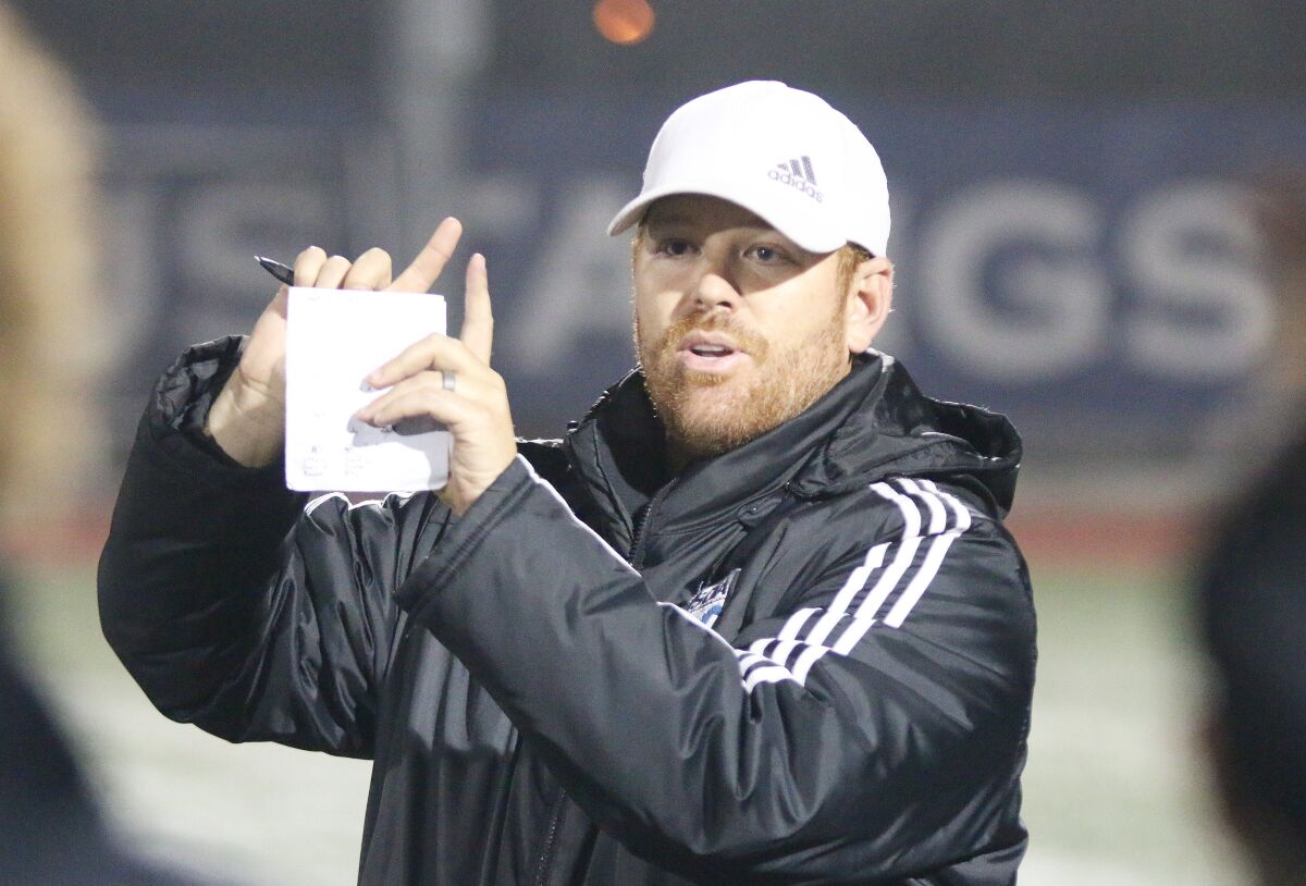SDA's fifth-year Head Coach Mike Elenz-Martin