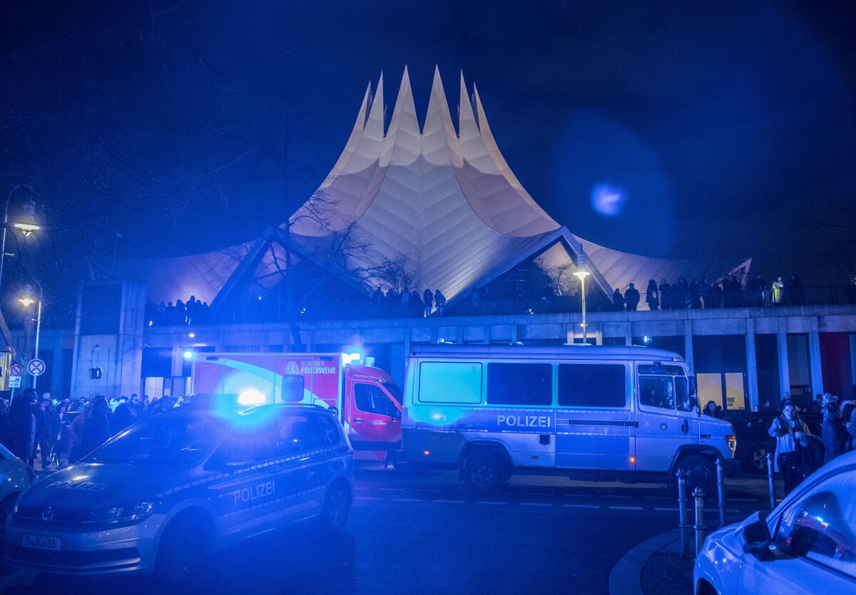Police and emergency cars in front of the Tempodrom venue after a shooting early Saturday in Berlin.