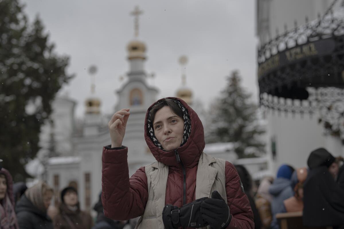 People pray in the Kyiv Pechersk Lavra monastery complex in Kyiv, Ukraine.