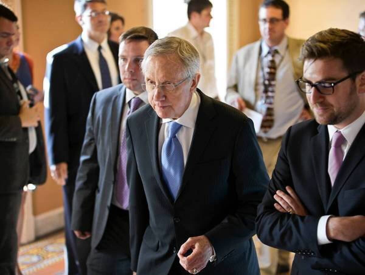 Senate Majority Leader Harry Reid (D-Nev.) said he would schedule votes on several of President Obama's nominees first thing Tuesday. If Republicans object to any, he could press forward with a landmark change in Senate rules.