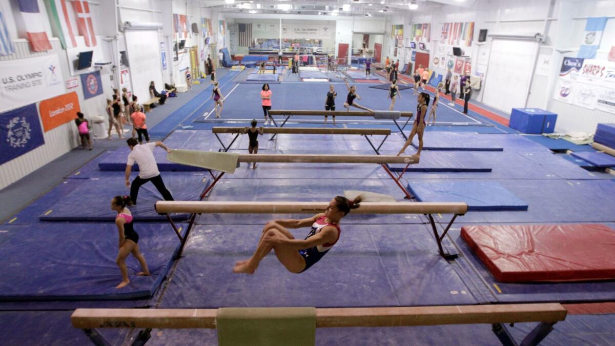 The U.S. national gymnastics team and invited guests work out at Karolyi Ranch on July 2, 2014.