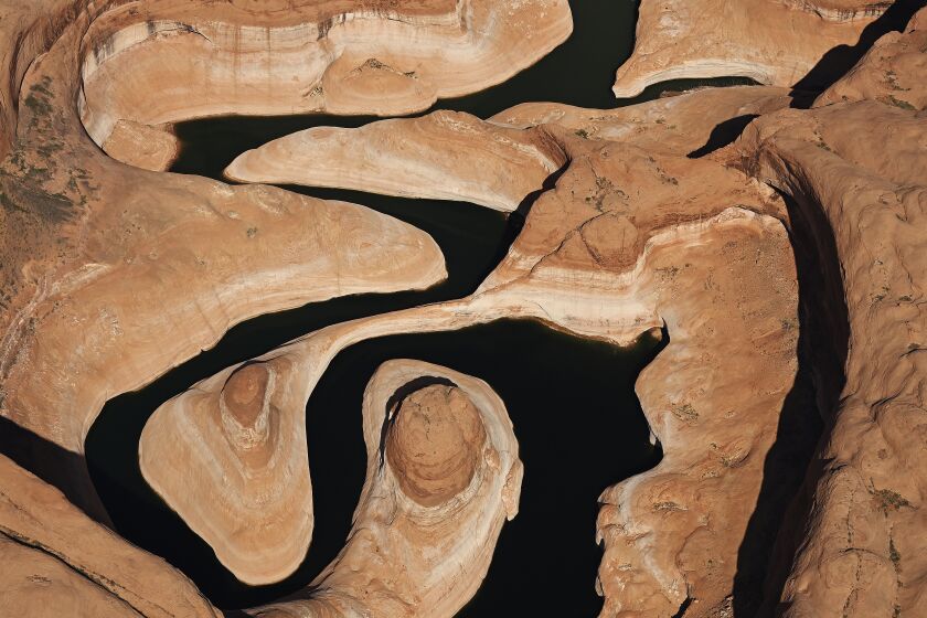 LAKE POWELL, UTAH - APRIL 15: A bathtub ring seen above the waterline around Lake Powell was created during drought that reduced the flow of the Colorado River on April 15, 2023 in Lake Powell, Utah. The flight for aerial photography was provided by LightHawk. (Photo by RJ Sangosti/MediaNews Group/The Denver Post via Getty Images)