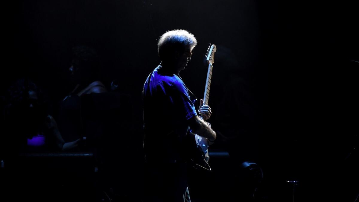 Eric Clapton performs Wednesday night at the Forum in Inglewood.
