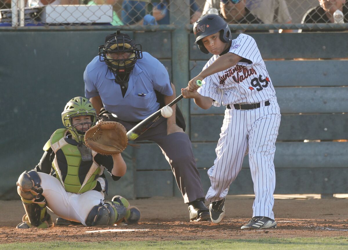 Brendon Krans hits a home run during the Section 10 Little League All-Star tournament championship game.