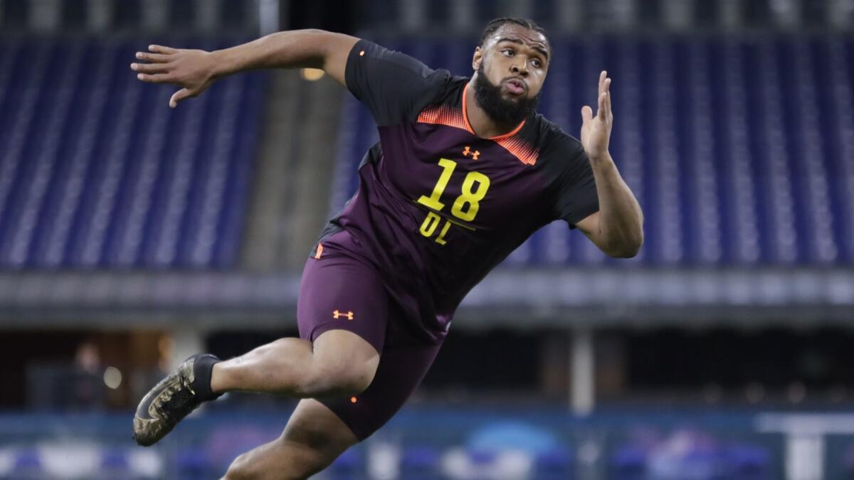 Clemson defensive lineman Christian Wilkins runs a drill at the NFL scouting combine.