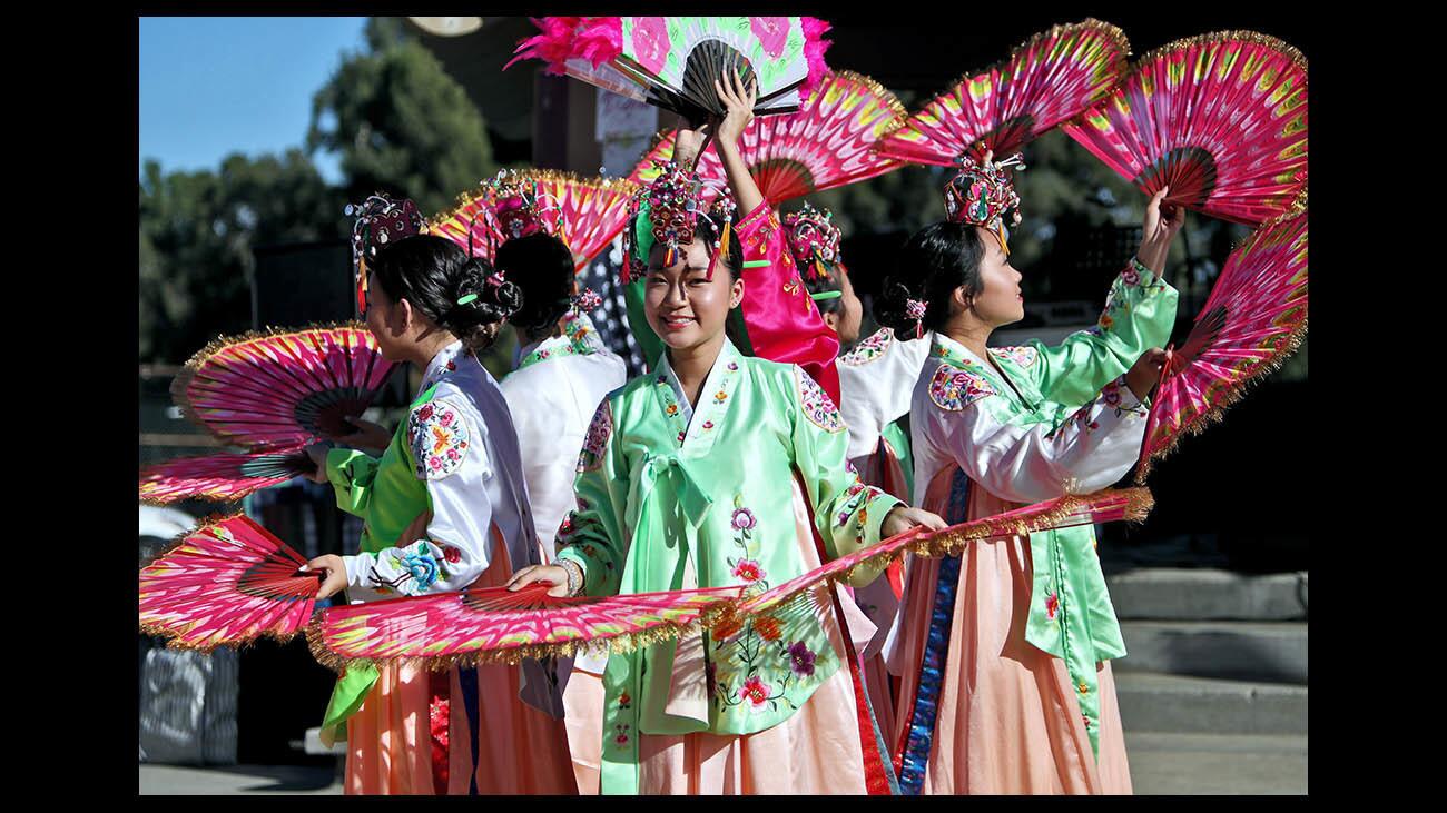 Janice Ha, 14 of Valencia, and the rest of the Hiza Yoo Korean Dance Institute dancers, perform the fan dance during the 4th annual Korean Culture Festival, at Memorial Park in La Canada Flintridge on Saturday, Sept. 15, 2018.