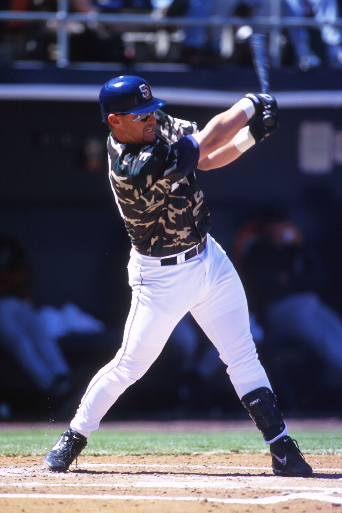 Padres third baseman Phil Nevin bats on April 13, 2000, at Qualcomm Stadium. This game marked the first time the Padres wore camouflage jerseys to honor the military.
