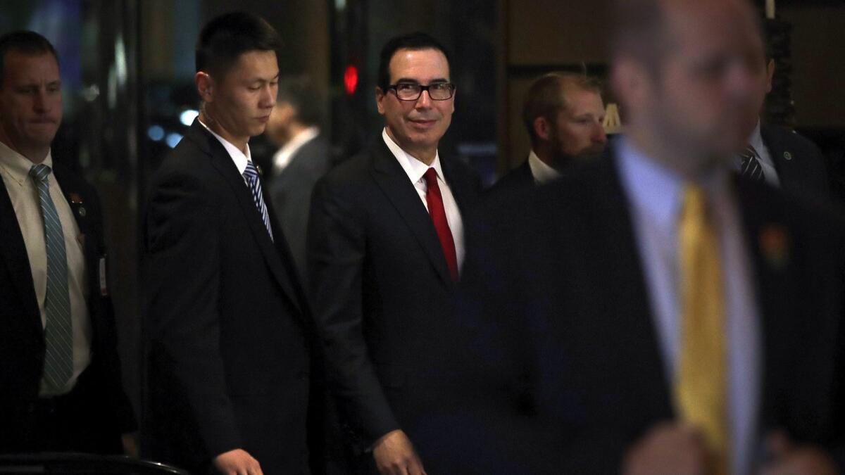 U.S. Treasury Secretary Steven T. Mnuchin, center, arrives with his delegation at a hotel after a meeting with Chinese officials in Beijing on Thursday, May 3, 2018.