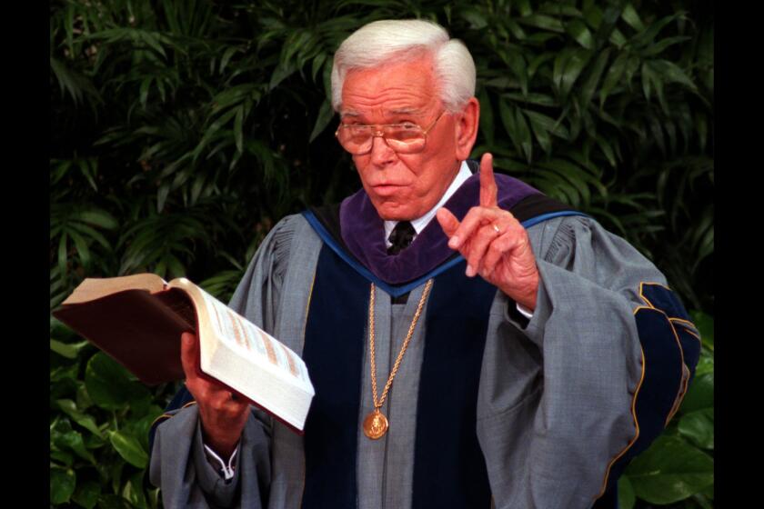 The Rev. Robert H. Schuller preaches at the Crystal Cathedral in 1997.